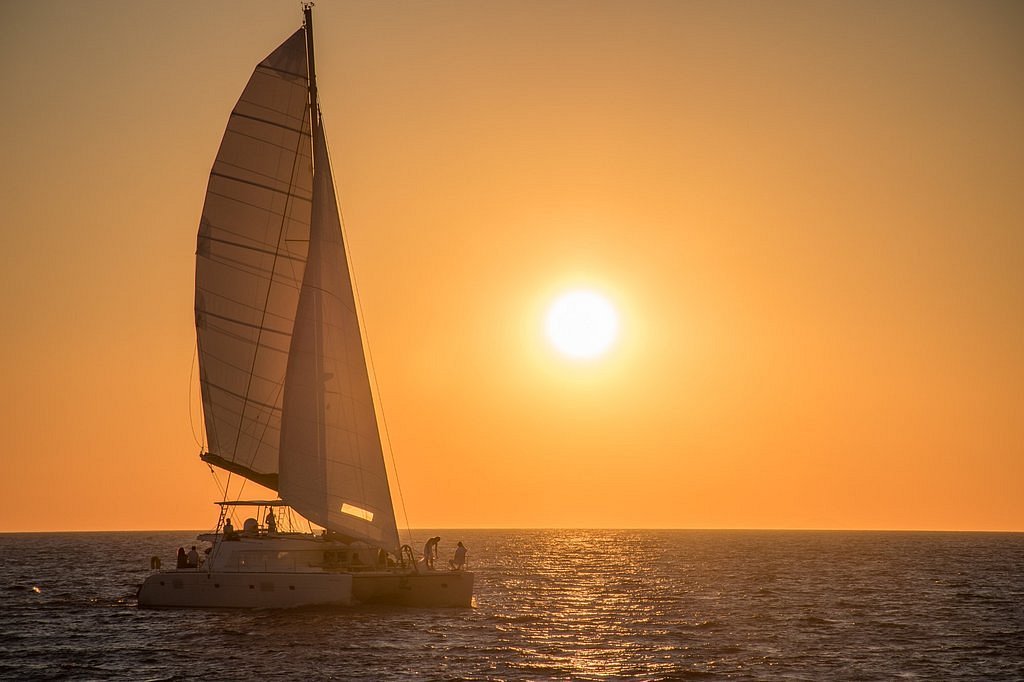 Private Catamaran Full Day Cruise with BBQ, Open Bar & Transfers