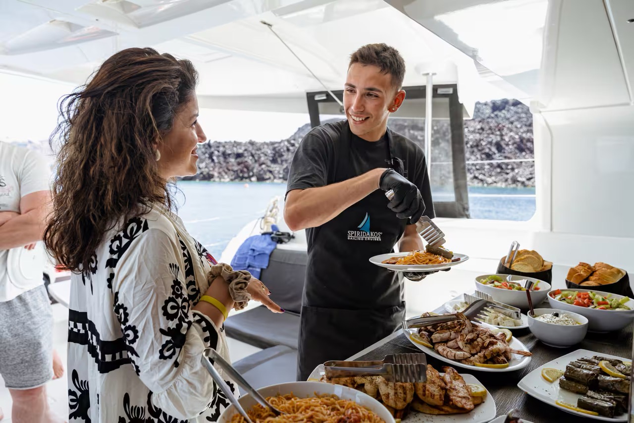 Catamaran Semi-Private Sunset Premium Ammoudi Cruise with BBQ, Open Bar & Transfers